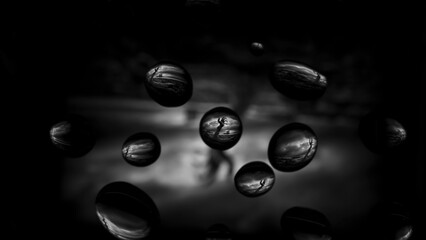 zombie rising from the ground in drops of water