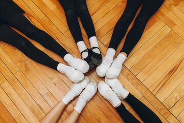 legs of female gymnasts in pointe shoes. gymnastics shoes