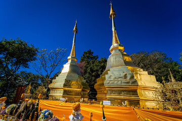 Naklejka premium Chiang Rai, Thailand - January, 09, 2021 : Wat Phra That Doi Tung is a beautiful golden temple in Chiang Rai province, Thailand.