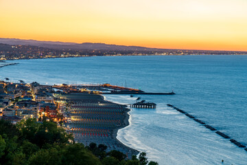 Sunset time in Gabicce Monte, amazing view on all the Riviera Romagnola beach  - obrazy, fototapety, plakaty