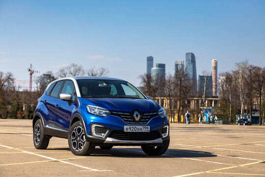 MOSCOW, RUSSIA - MARCH 12, 2021: The new blue Renault kaptur crossover stands on the road in big city
