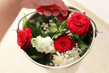 a Beautiful Red Rosses flower in a vintage bucket.