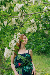 Beautiful long hair woman walking in the forest in spring