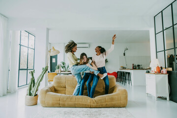Diverse group of female friends enjoying party and laughing together - Women friends having fun at...