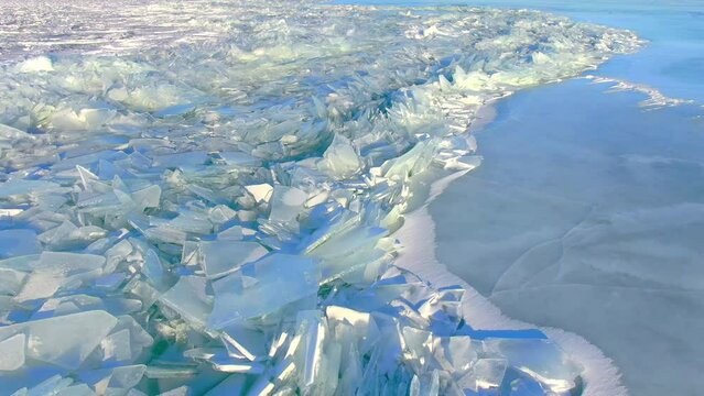Broken jagged ice after an ice shove. Ice shoves are caused by high winds which actually grip a vast sheet of ice and push it in one direction until it cracks and heaves and then starts a chain of bre