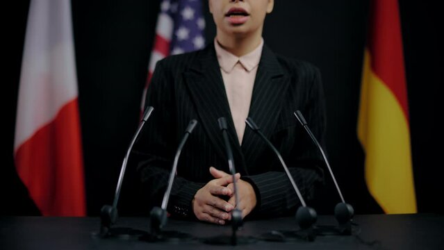 Female defense official speaking international cooperation conference, politics