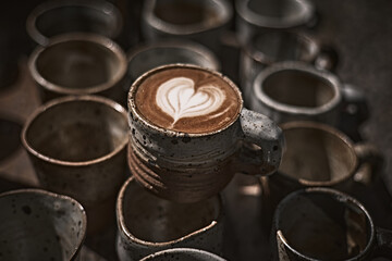 Selective focus cup of hot latte art coffee