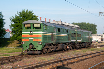 Fototapeta na wymiar Cargo diesel locomotive 2TE10U-0079 at Molodechno station of Belarusian Railway, Molodechno, Minsk region, Belarus, June 14, 2015