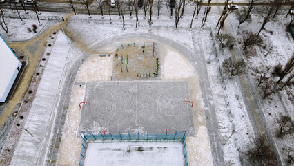 Basketball field top view in the winter filming on drone - obrazy, fototapety, plakaty
