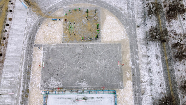 Basketball field top view in the winter filming on drone