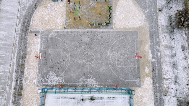 Basketball field top view in the winter filming on drone