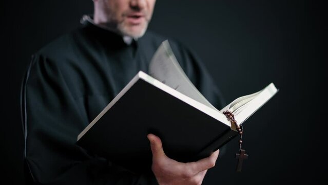 Priest reading holy Bible at wedding ceremony, blessing of marriage, religion