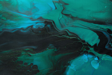 Fluid Art. Green, Black and blue abstract waves with golden particles. Marble effect background or...