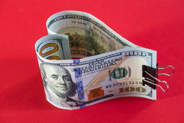 heart made from 100 dollar banknotes