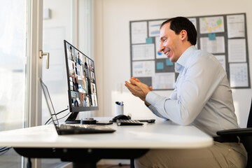 Fototapeta na wymiar Man Clapping In Online Video Conference Business
