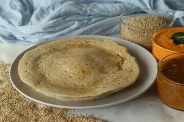 Little millet soft dosa. Made with a fermented batter of little millet, lentils and fenugreek seeds. Served with sambar and coconut chutney