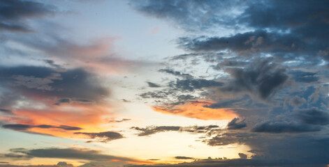 blur The vast Beautiful sky and four orange clouds that are beautiful sky before sunset. The natural sky before background has a breeze on a bright day in the summer.