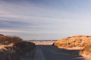 Sand road through the dunes, Entrance to the Blokhus Strand. Nordjylland (North Jutland Region), Denmark