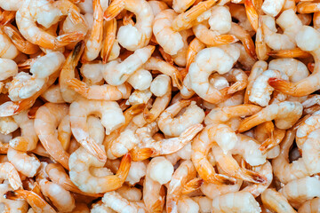 Frozen shrimp. Trade in high-quality seafood wholesale and retail. flat lay frame - obrazy, fototapety, plakaty