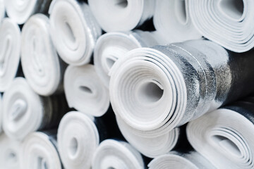 Foil insulation in rolls. Trade in high-quality building materials for heat and energy saving. selective focus