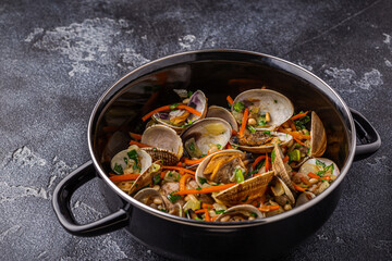 Shells vongole venus clams with vegetables and herbs