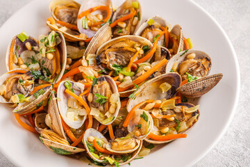 Shells vongole venus clams with vegetables and herbs