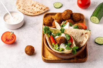 Falafel and fresh vegetables in pita bread