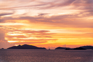 Fototapeta na wymiar sunset or sunrise seascape on koh Lipe isaland with gold lighting sunset sky background