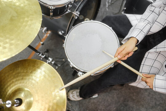 A close up of musician's hands. Drum kit playing.
