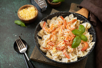 Mediterranean cuisine, seafood diet, italian cuisine. Pasta farfalle with grilled shrimps bechamel...