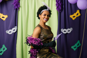 African American woman wearing carnival costume and make-up for Mardi Gras festival.