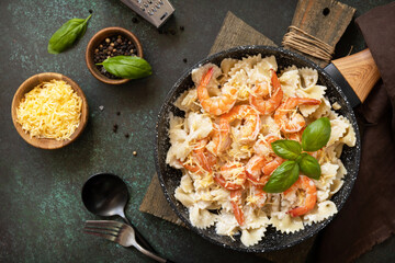 Mediterranean cuisine, seafood diet, italian cuisine. Pasta farfalle with grilled shrimps bechamel...