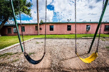 empty swings on the playground