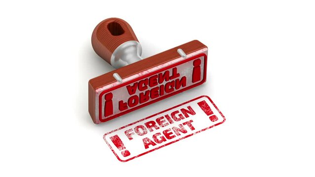 Foreign agent! The stamp and an imprint. The rubber stamp leaves a red imprint FOREIGN AGENT! on a white surface. Footage video