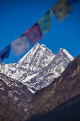 Himalaya mountains in Nepal with prayer flags. Tamang Heritage Trail and Langtang trek day 3 from Tatopani to Nagthali