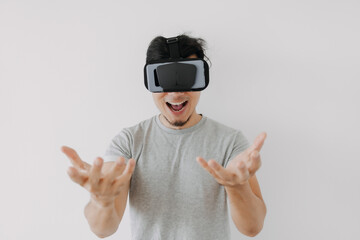 Asian man wears virtual glasses for interactive virtual meta world technology.