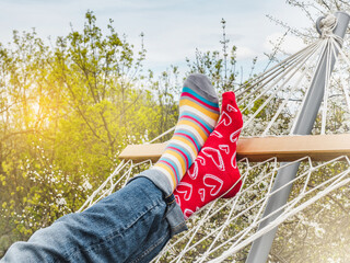 Men's legs and bright socks. Close-up, outdoor. Style, beauty and elegance concept