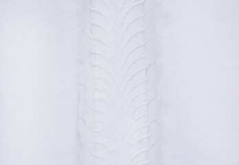 Tire print from a car in the snow