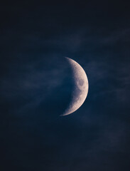 Obraz na płótnie Canvas Beautiful moon in the clouds. Blue background
