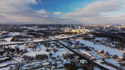 Low-rise urban development. The ground and buildings are covered with snow. Winter cityscape....