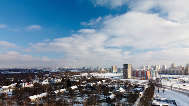 Low-rise urban development. The ground and buildings are covered with snow. Winter cityscape. Aerial photography. © f2014vad