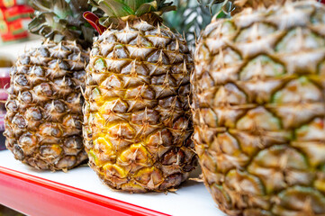 Pineapples are on the shelf in the store
