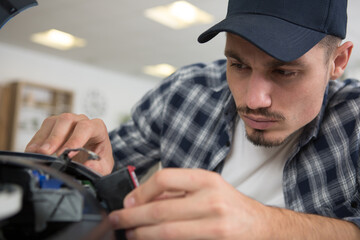 specialist repairman serves the laser printer