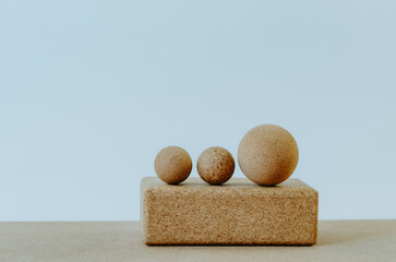 Fototapeta na wymiar Isolated cork therapy balls on yoga block with white background