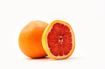 Isolated red grapefruits. Whole red grapefruit and slice of fresh grapefruit isolated on white background with clipping path
