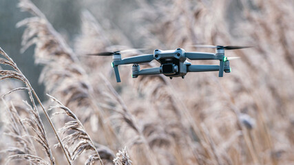 Drone in flight over marshland, Devon, England