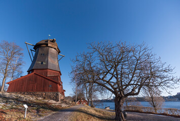 Old red mill for production of linseed oil, built 1784, a sunny winter day at the waterfront in the island Djurgården, Stockholm