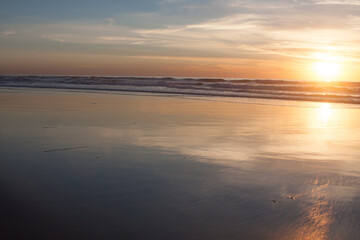 Fototapeta na wymiar sunset on the beach at low tide