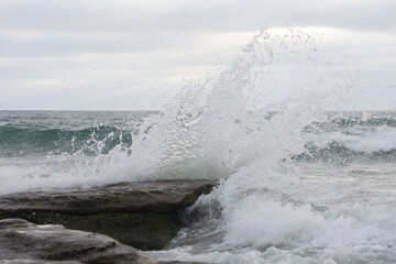 wave breaking on the rocks