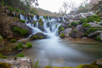 Fototapeta na wymiar small waterfall in castelões river in Tondela, Portugal